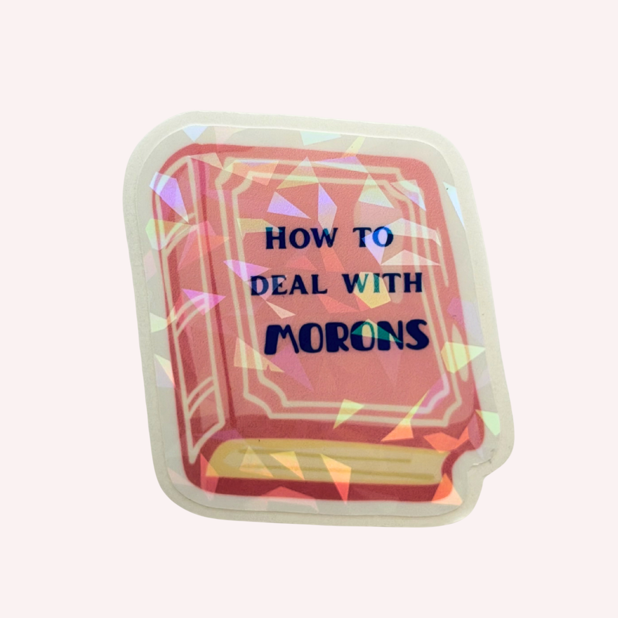 How to Deal with Morons Sticker | Funny Pink Book Holographic Sticker | Sarcastic Book Lover Sticker | Water-Resistant Sticker