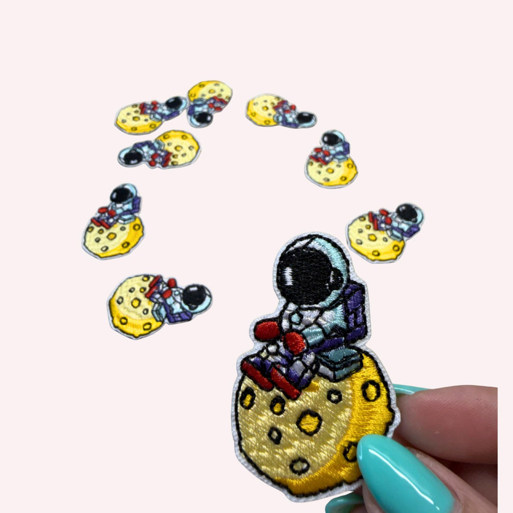 Astronaut Sitting on the Moon Iron-On Embroidery Patch (Approx. 2 inches)